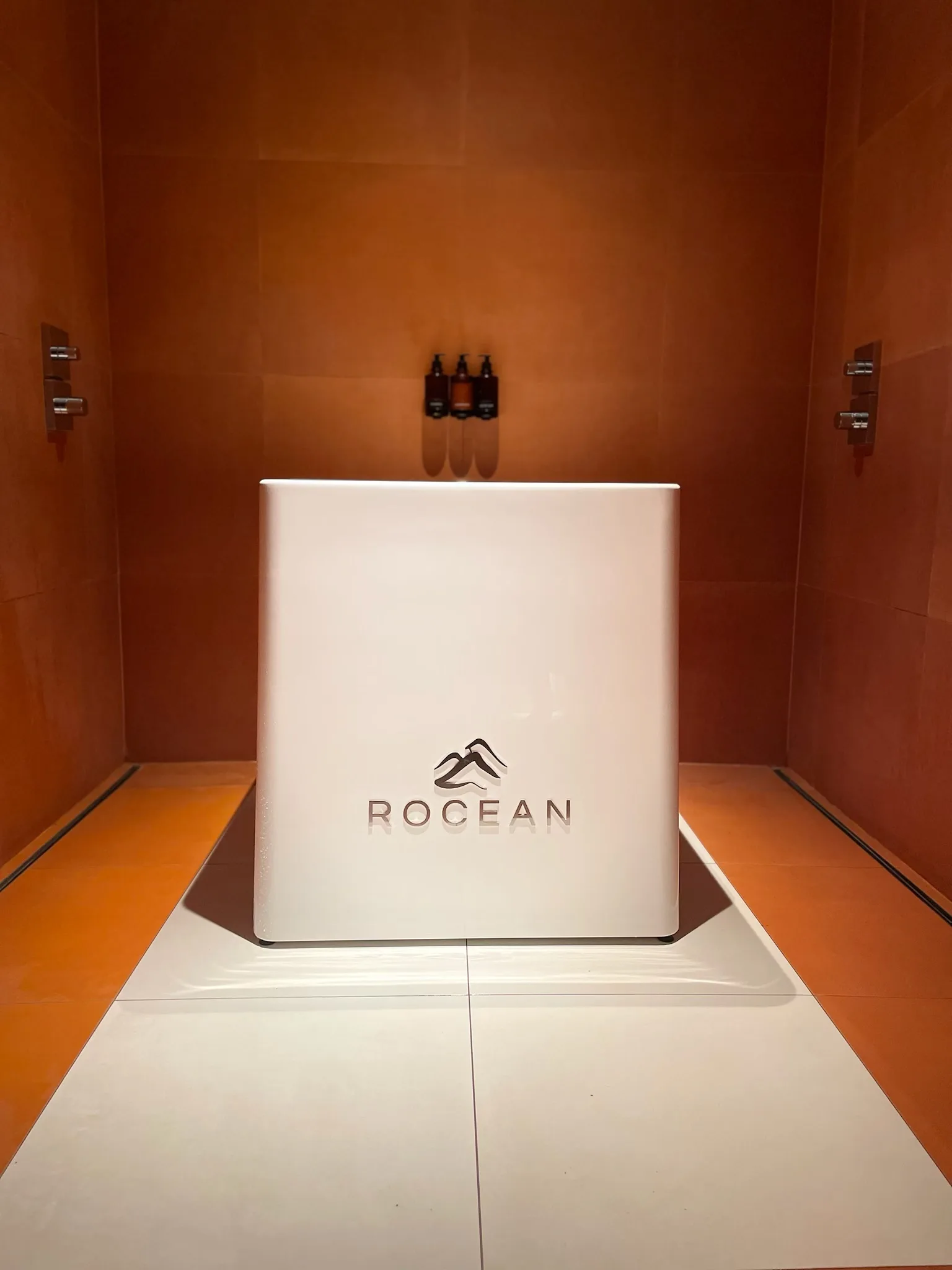 Rocean cold plunge unit installed in a spa shower room